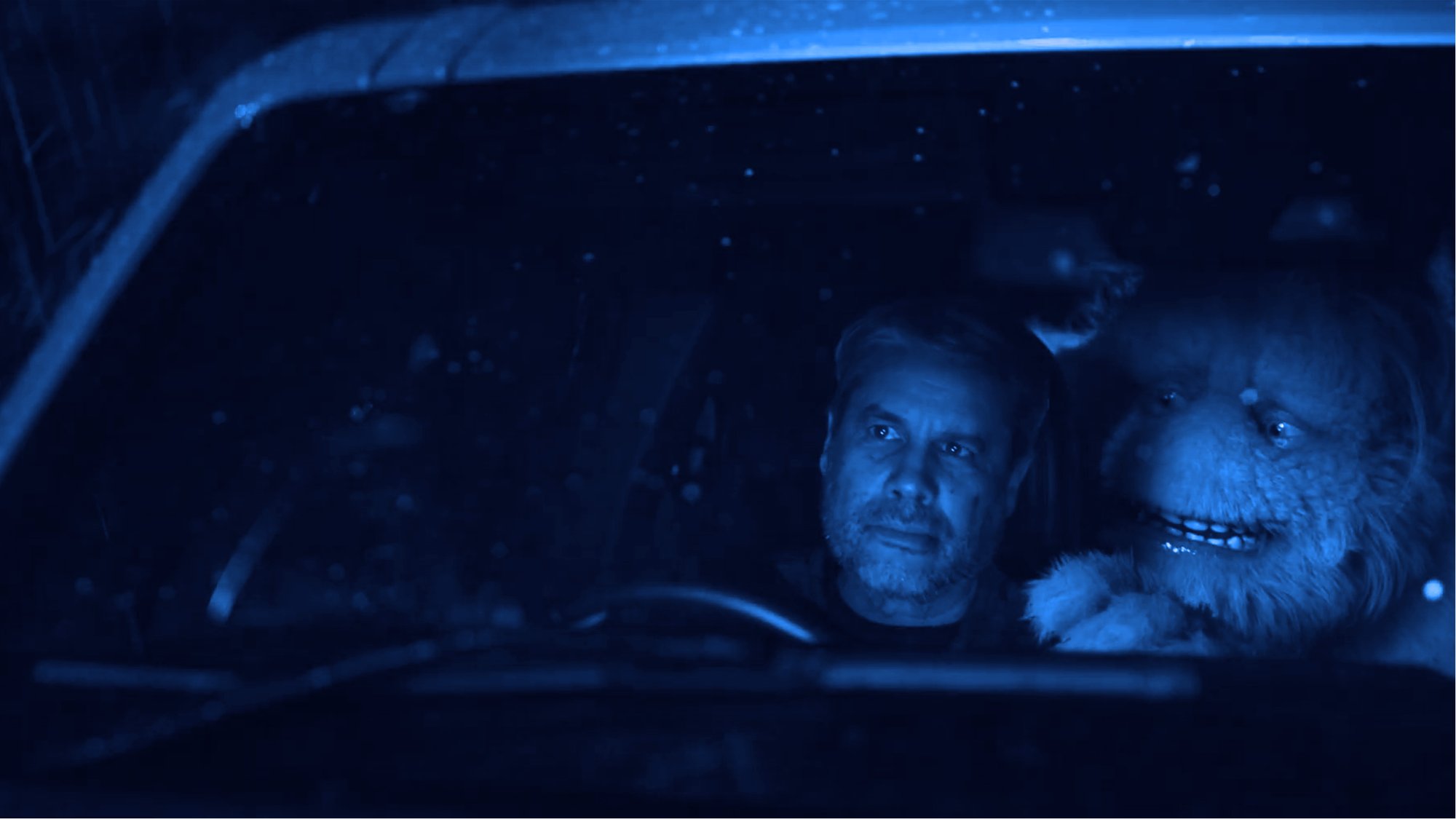 Man driving trying to ignore the urge to pee