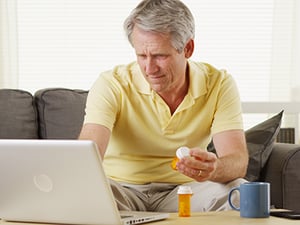 Man looking up BPH meds on computer