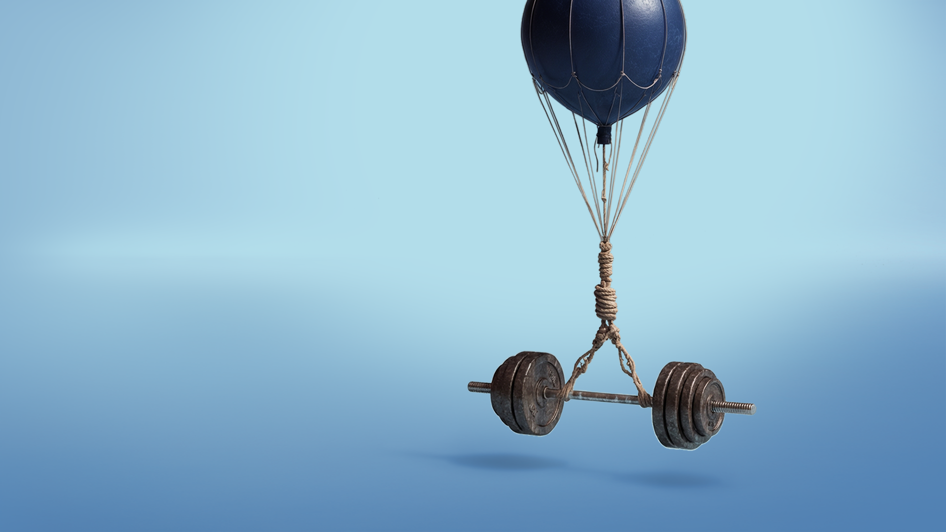 Baloon lifting barbells off the ground