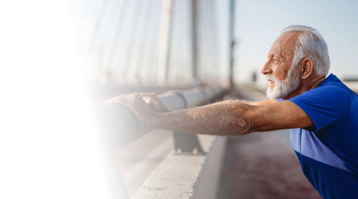 Man leaning against a railing