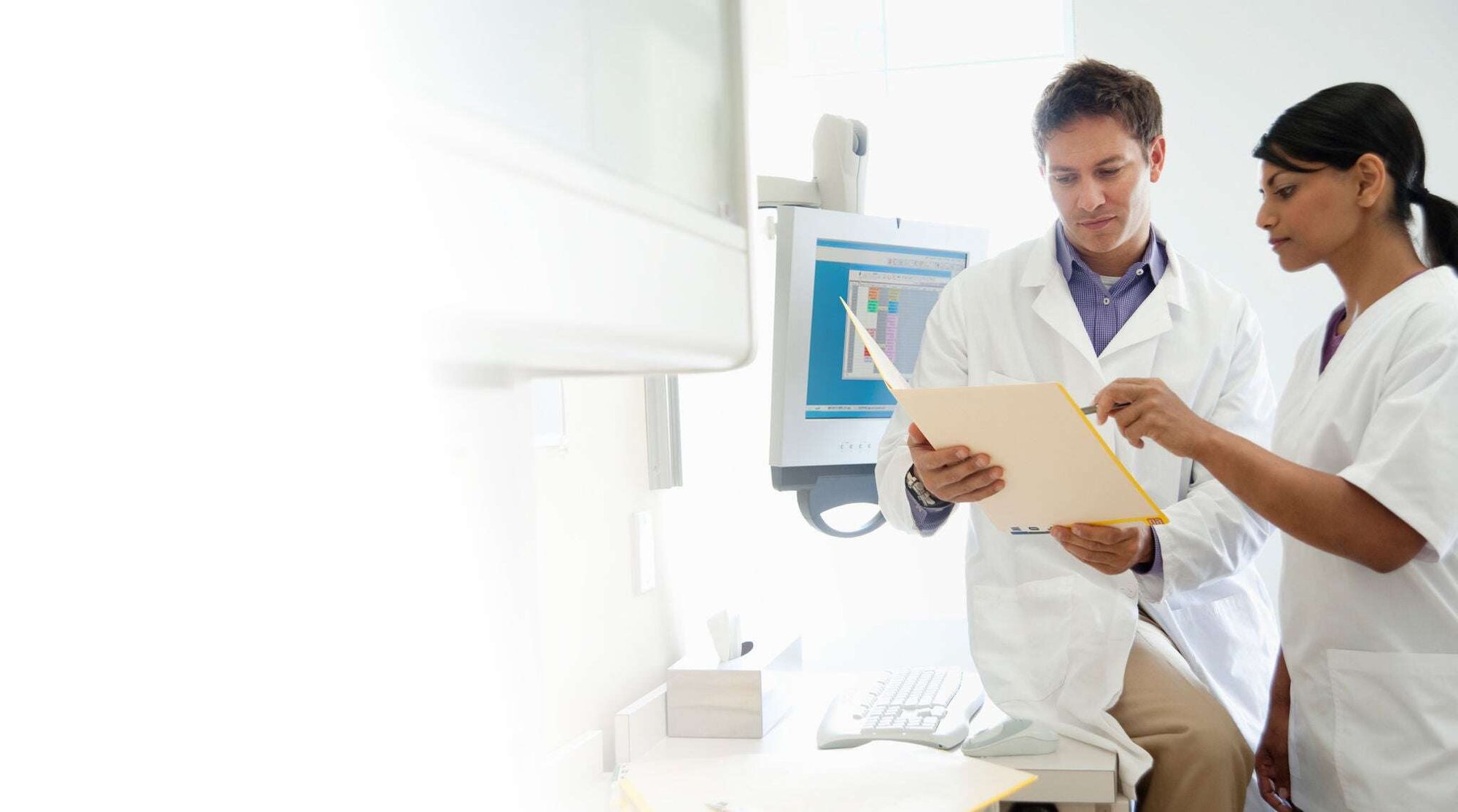 Two doctors reviewing a patient's test results