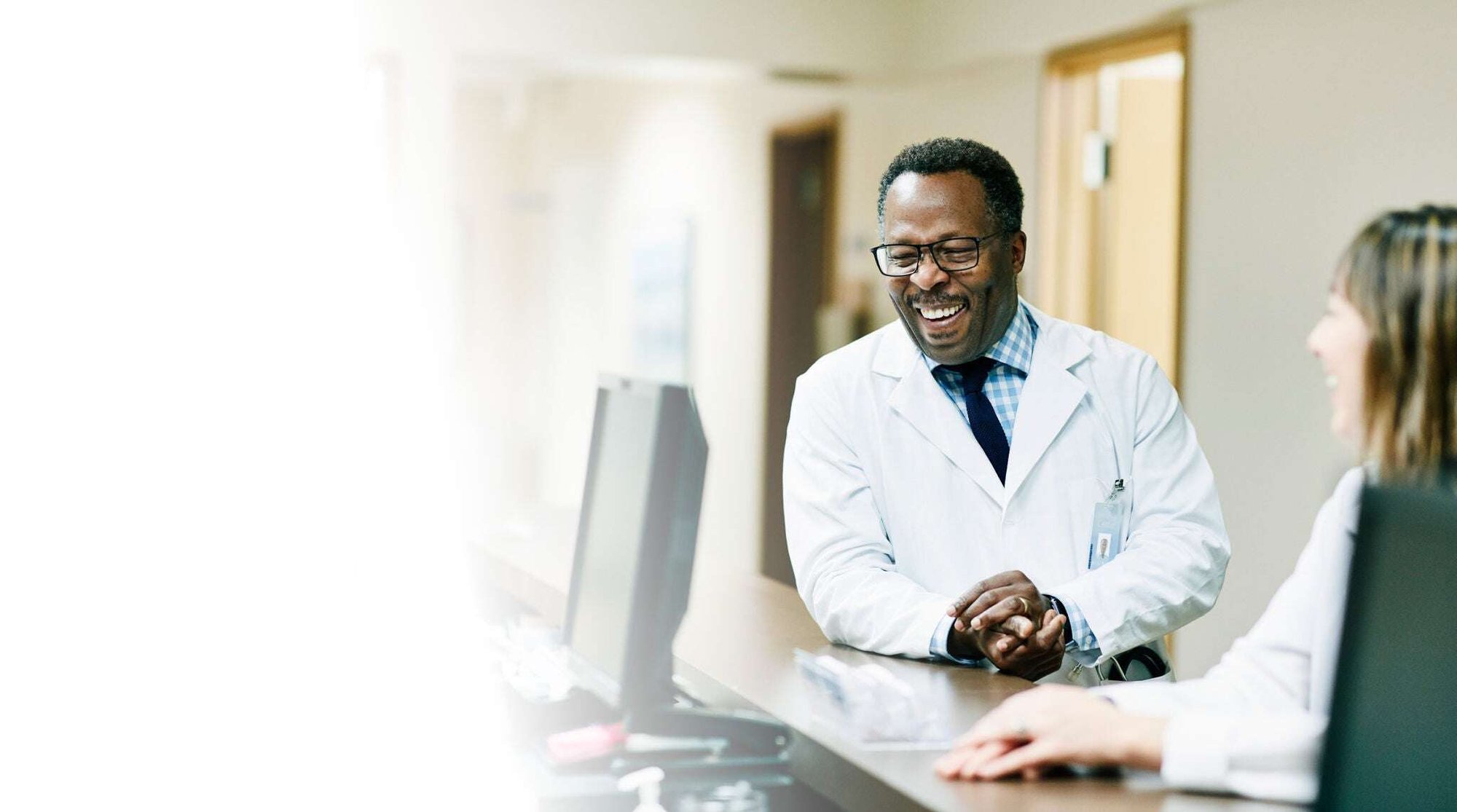 Doctor and patient laughing