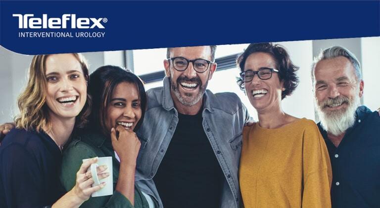 Five people standing in a row smiling